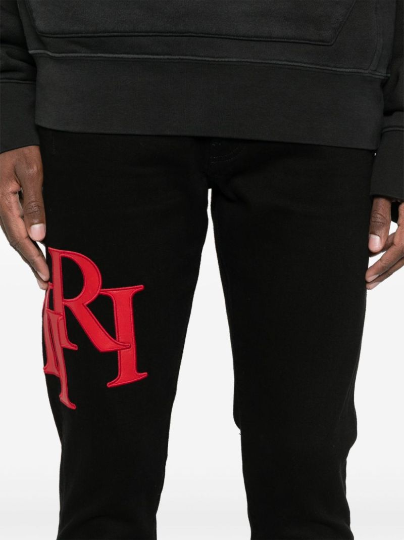 Black Staggered Jeans