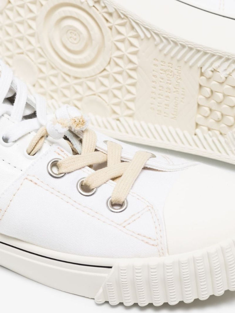 White Evolution Low Top Sneakers