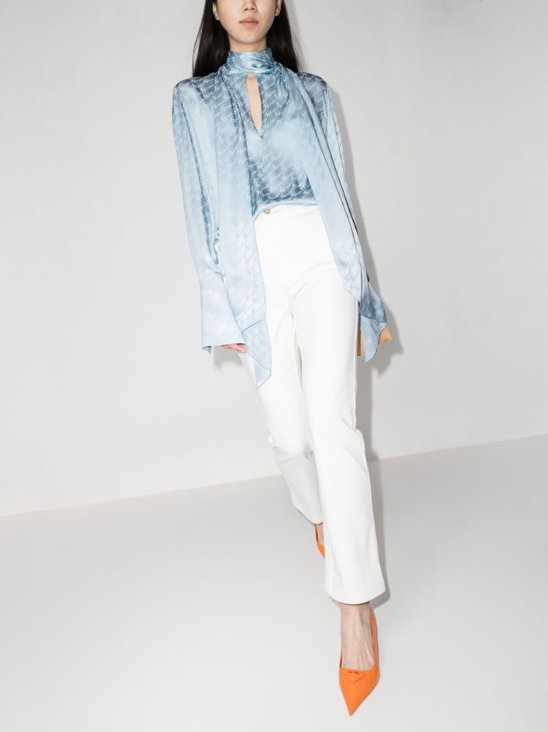 Logo Embossed Slim Leg Jeans