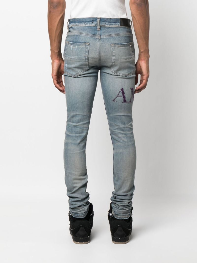 Blue Serif Logo Distressed Skinny Jeans