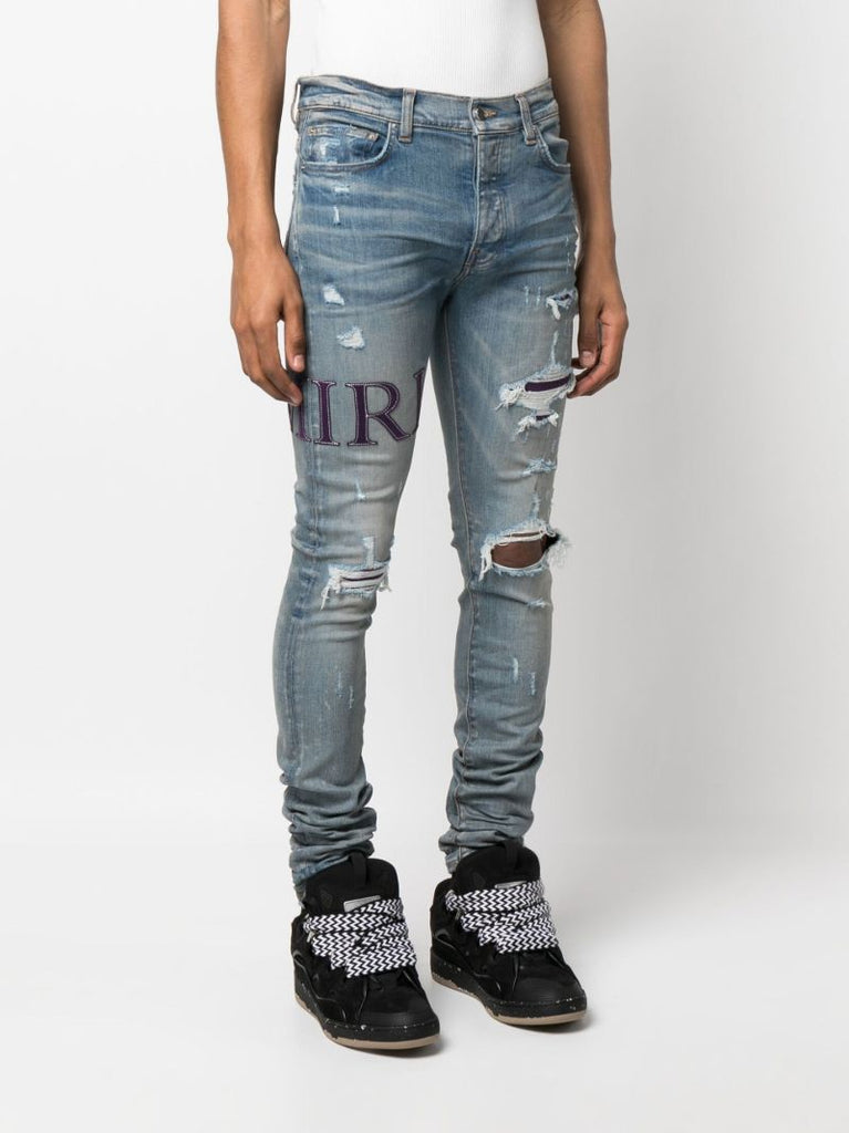 Blue Serif Logo Distressed Skinny Jeans