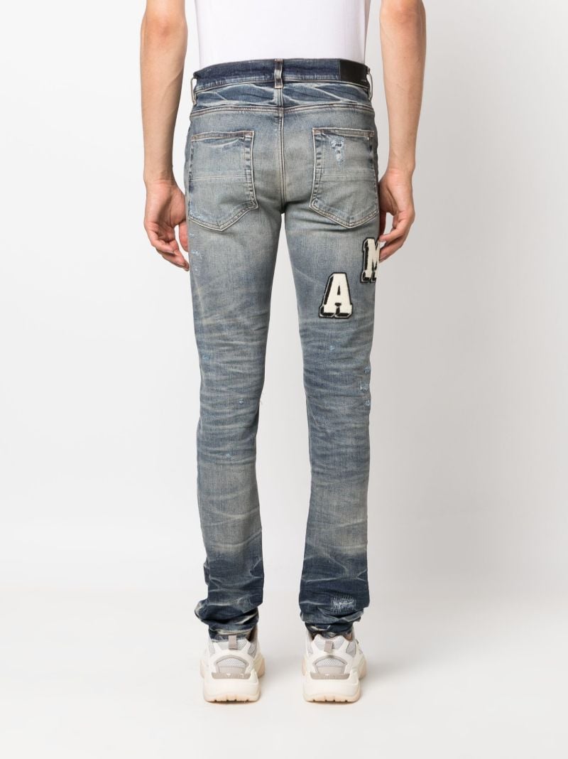 Blue Amiri Varsity Skinny Jeans