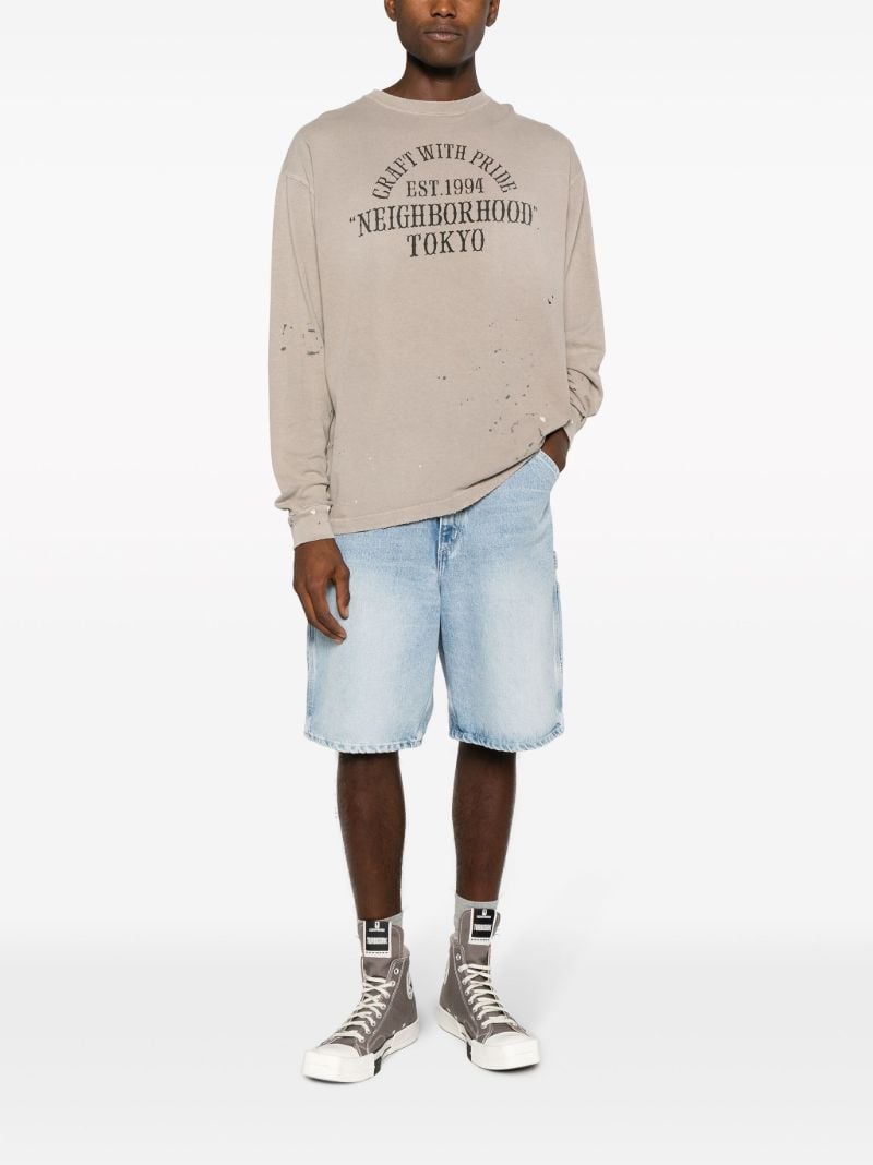 Neutral Damage Slogan-print T-shirt