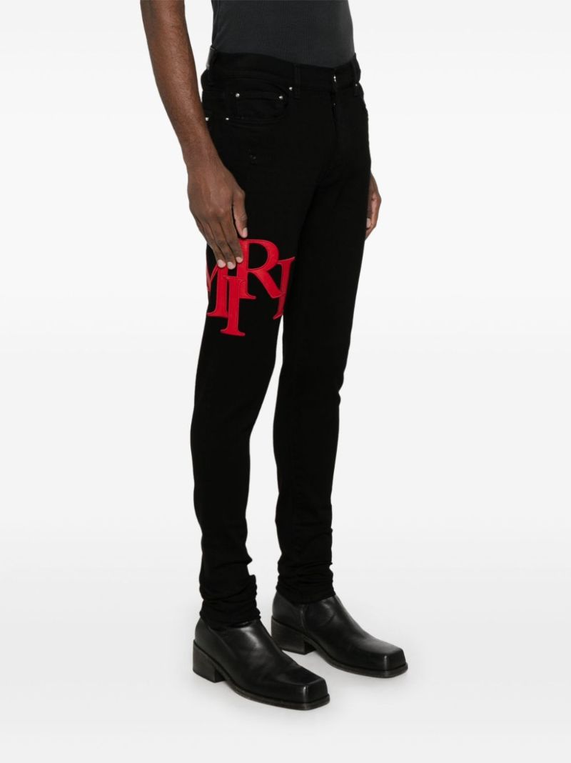 Black Staggered Jeans