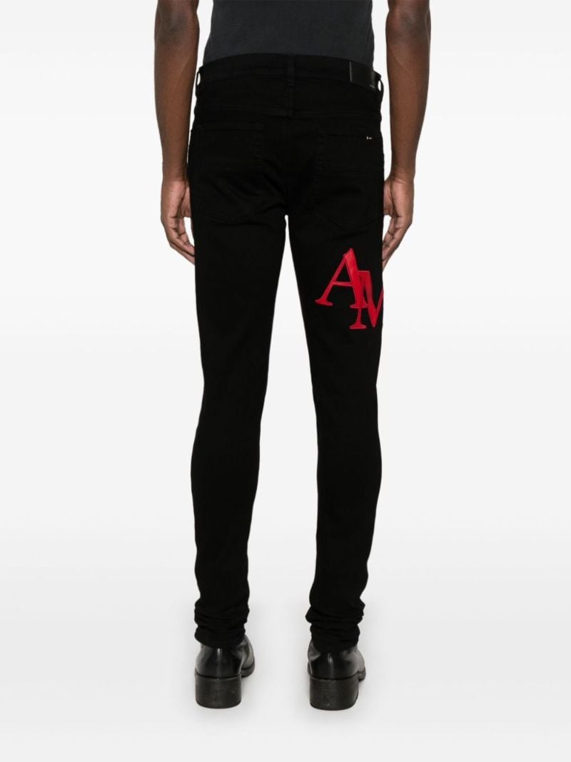 Black Staggered Jeans
